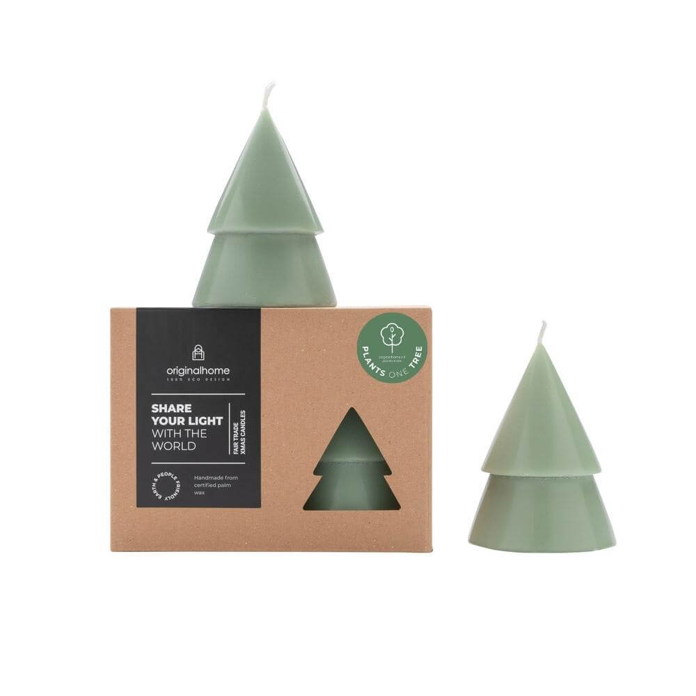 Two light green Christmas tree-shaped candles shown next to its brown kraft paper packaging box, with the candle standing on top of and next to the box on a white background.