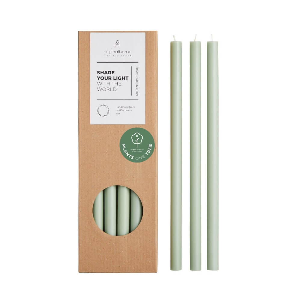 Three light green thin candles displayed next to their brown kraft paper packaging box of 10 candles, which features a circular window showing the candles inside and a green 'Plants Based' sticker.