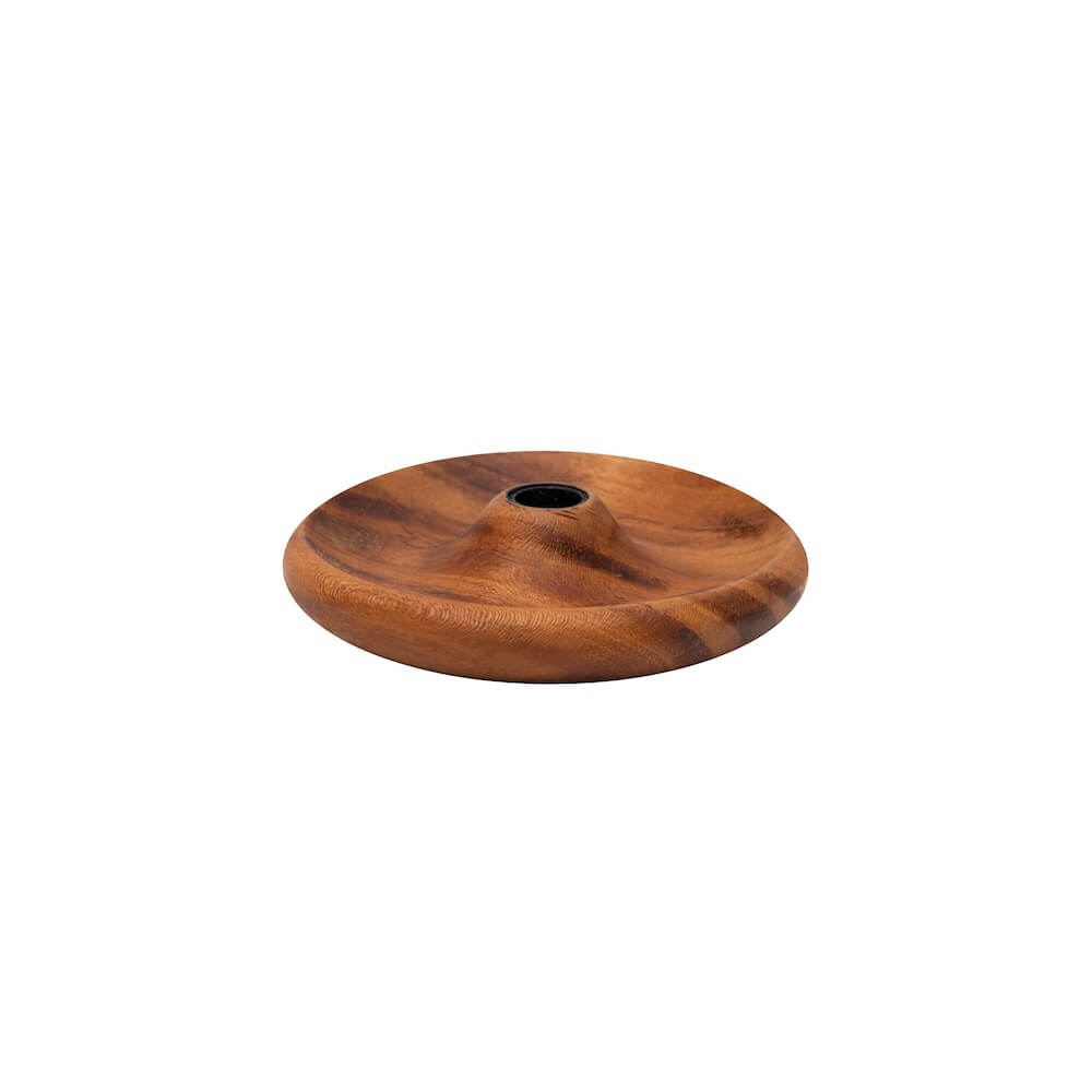 A round wooden candle holder with a central hole, showing natural brown wood grain, on a white background.