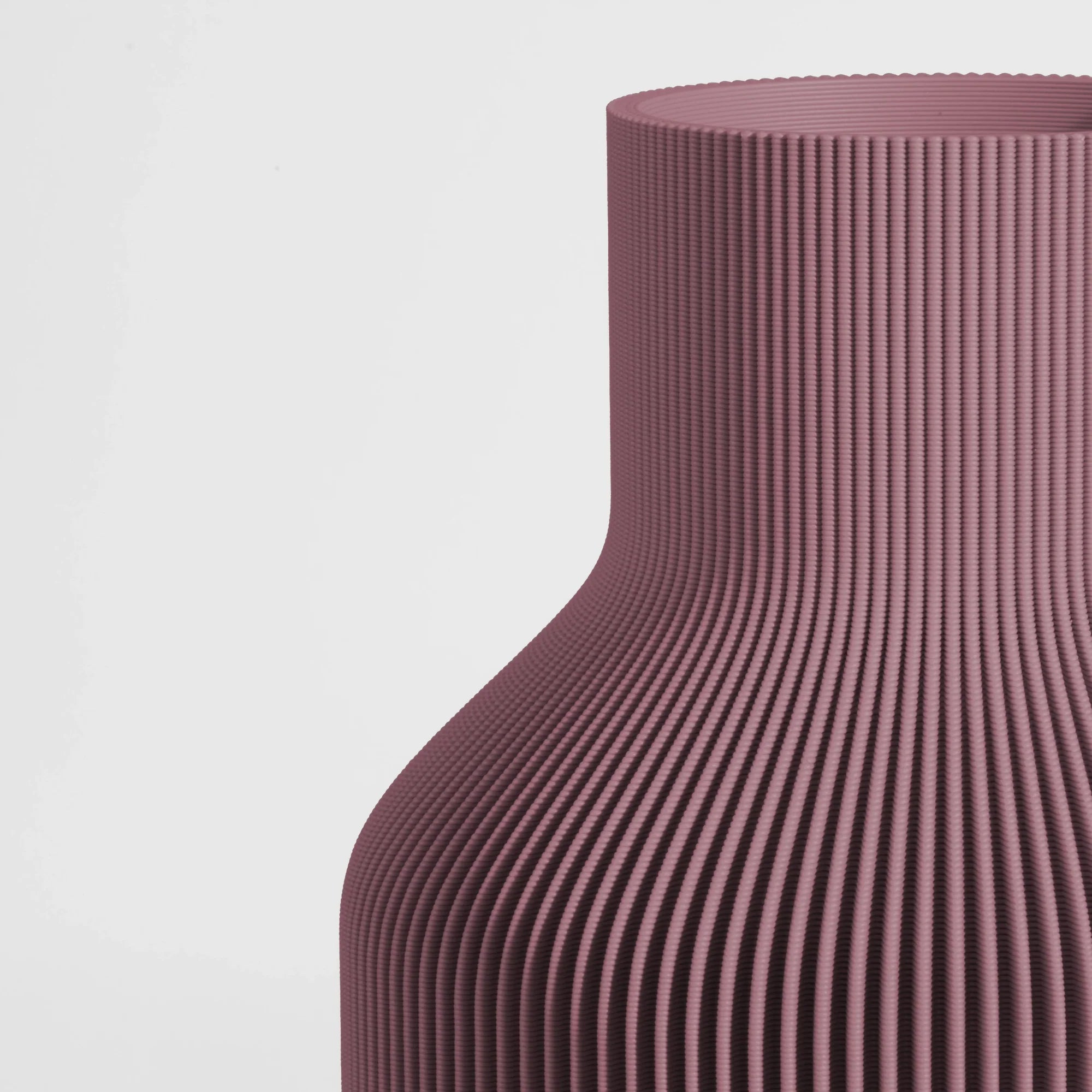Close-up of a textured Ash Mauve vase on a light gray background.