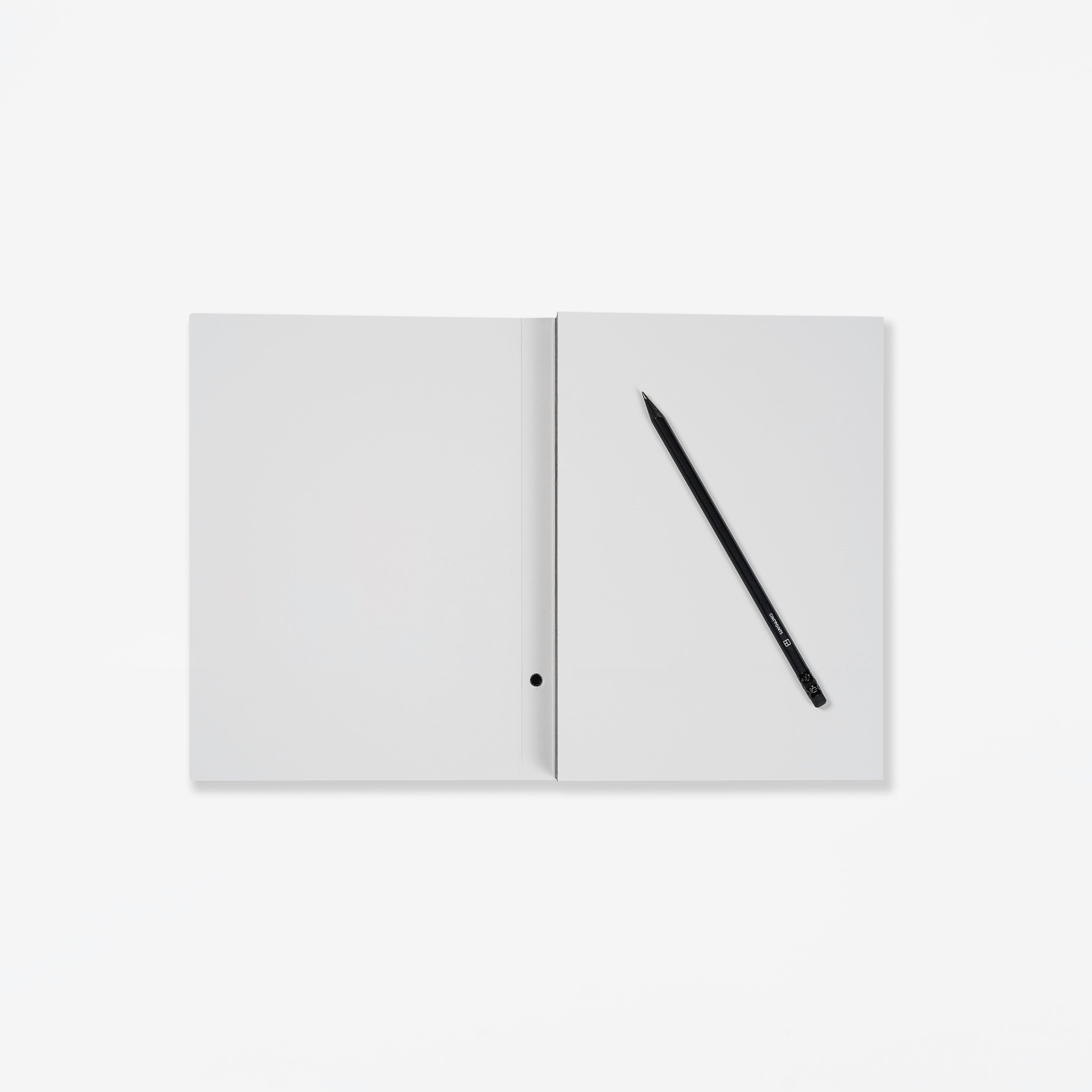 Open notebook with a pencil on a white background