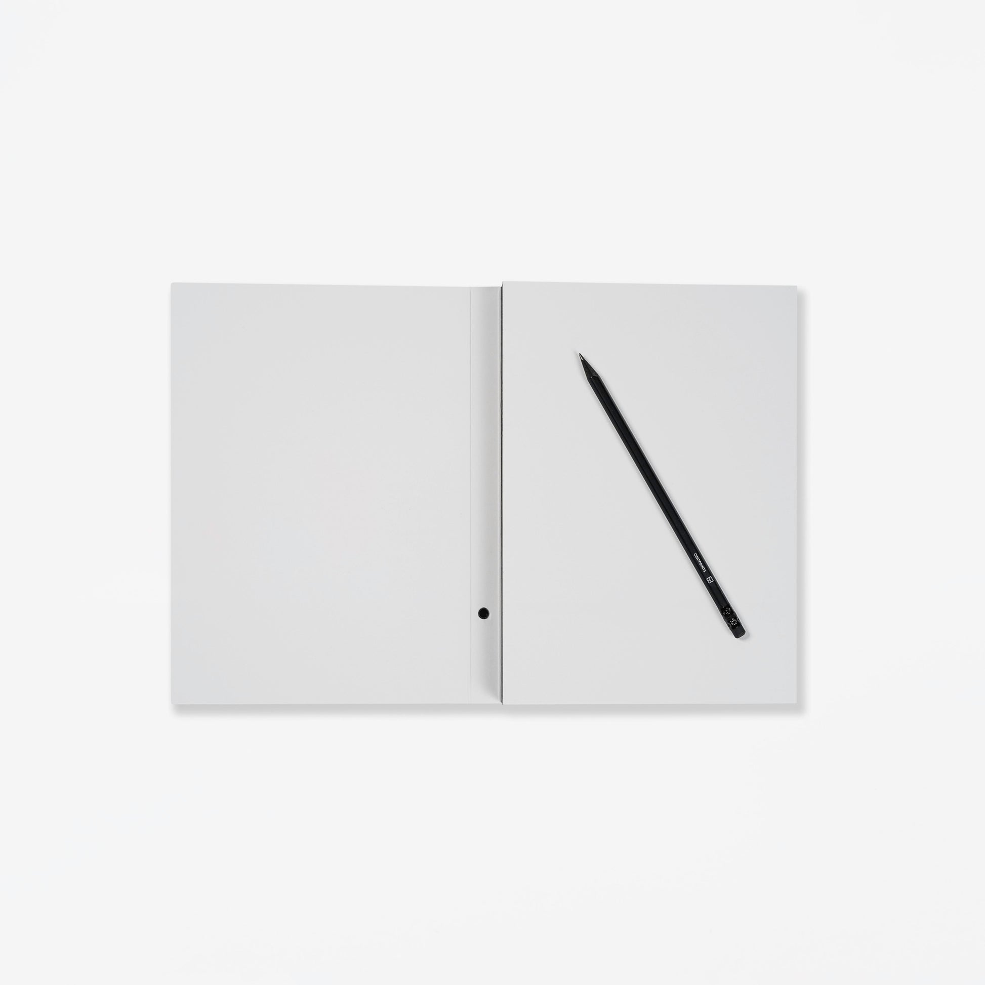 Open notebook with a pencil on a white background