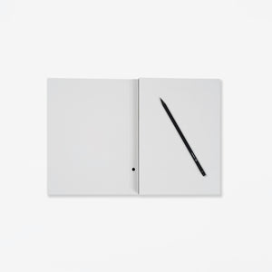 Open notebook with a pencil on a white background