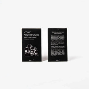 Two black rectangular card boxes standing upright on a white background, showing the front and back of an 'Iconic Architecture Family Card Game' set.