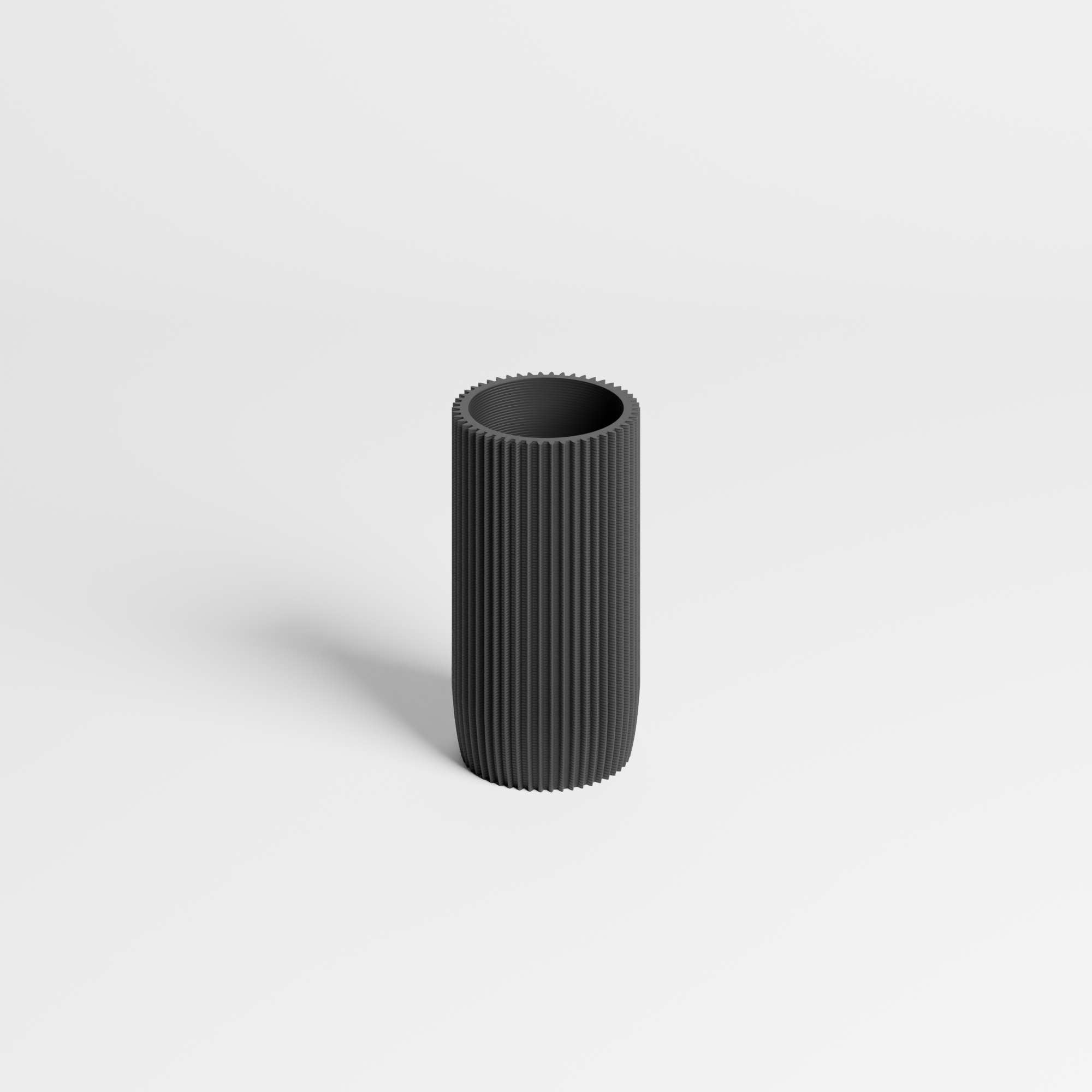 A black ribbed cylindrical pen holder with a fluted texture, standing upright on a light gray background.