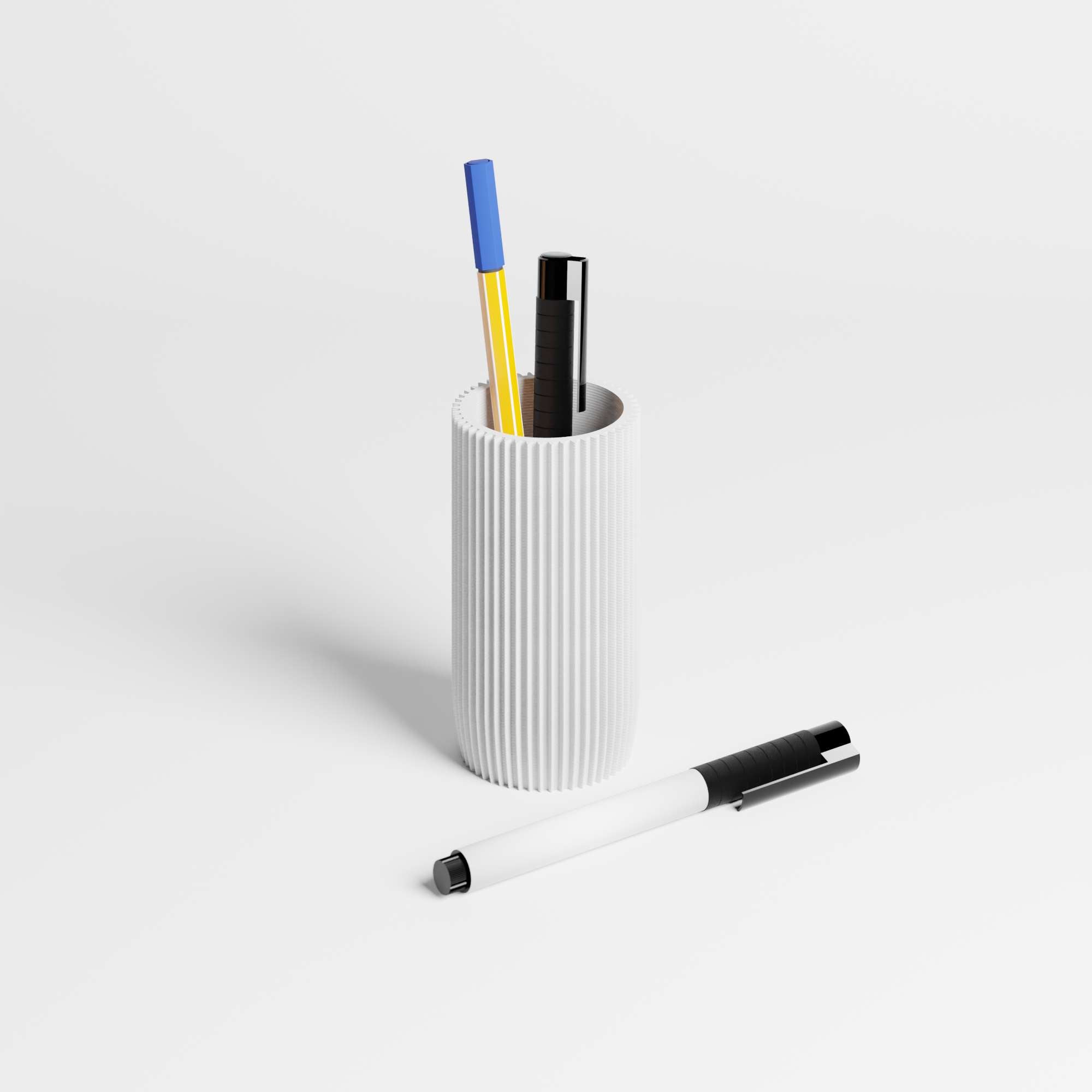 A ribbed white pen holder cup containing three pens, with a matching white pen with a black clip lying in the foreground on a clean white surface.