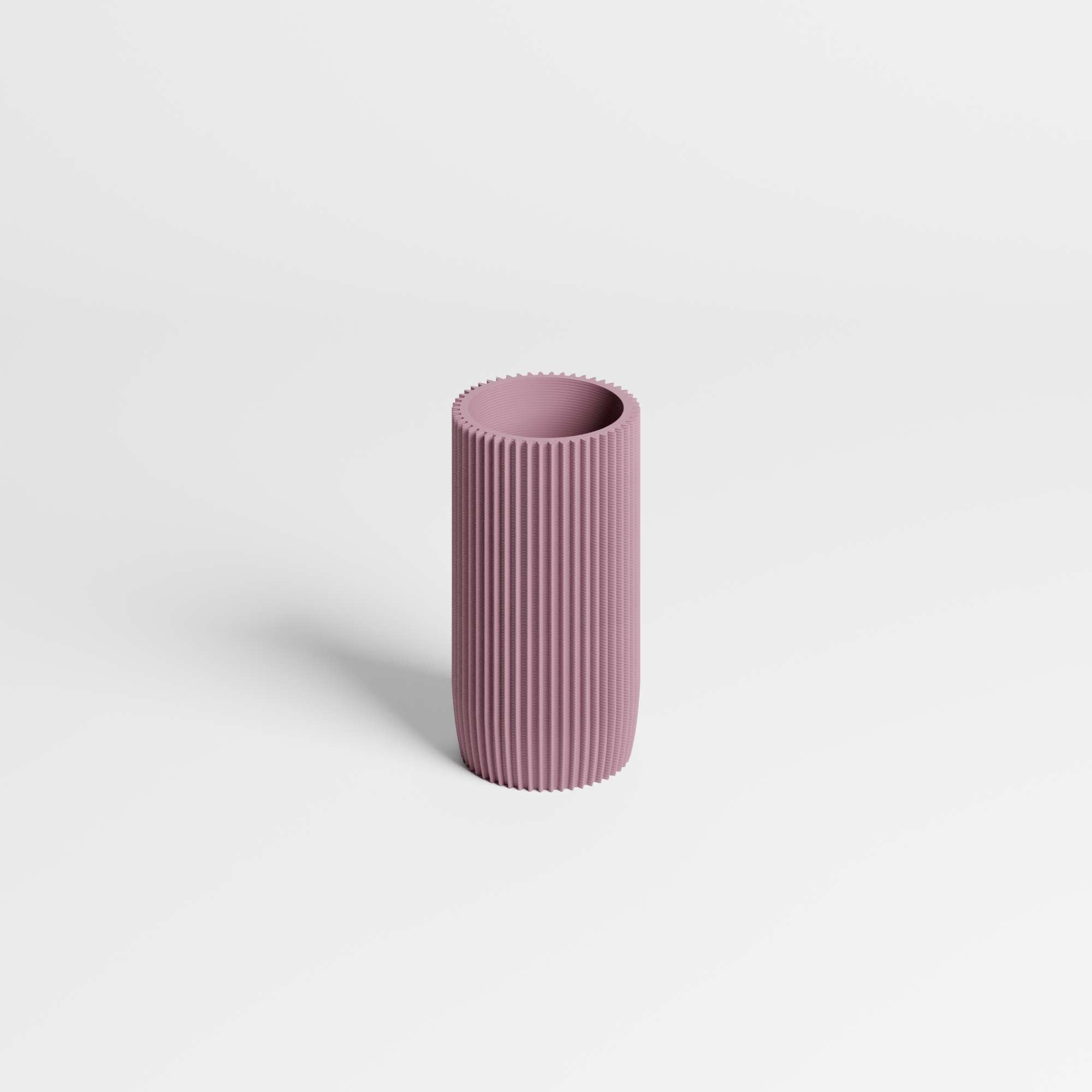 A minimalist, ribbed cylindrical pen holder in a dusty mauve-purple colour, standing upright on a clean white background.