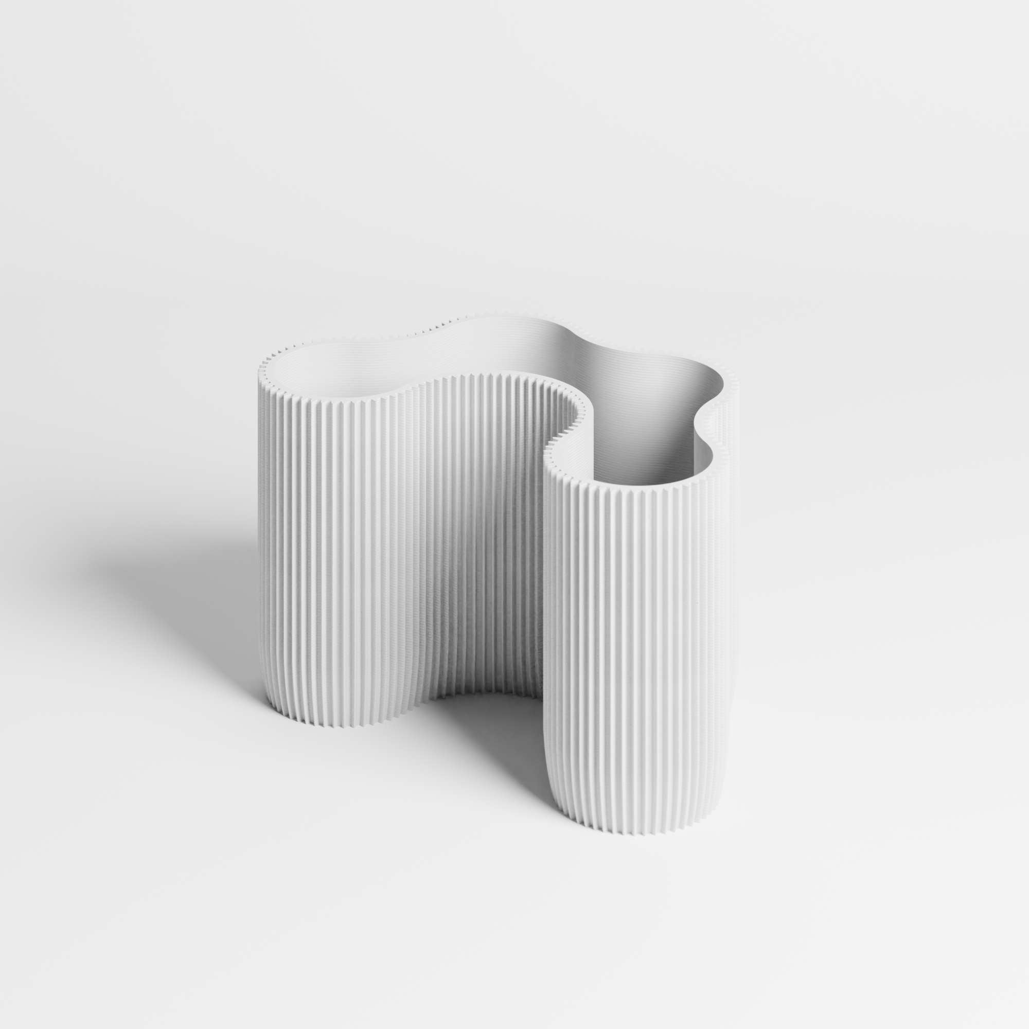 A flowing ribbed desk organiser in a white colour, shown on a clean white studio background.