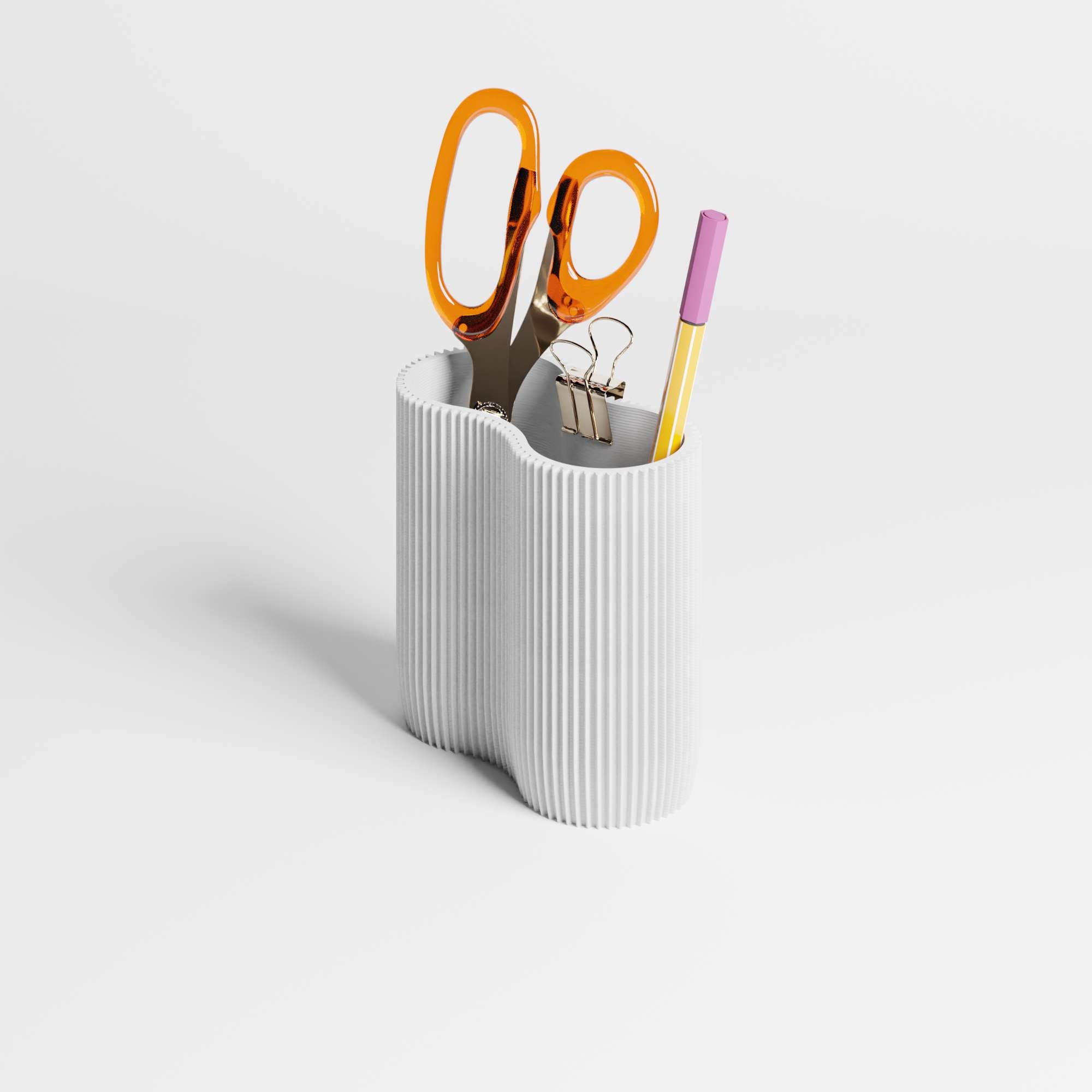 White ribbed pen holder with orange scissors, pink pen, and gold clip on a light gray background