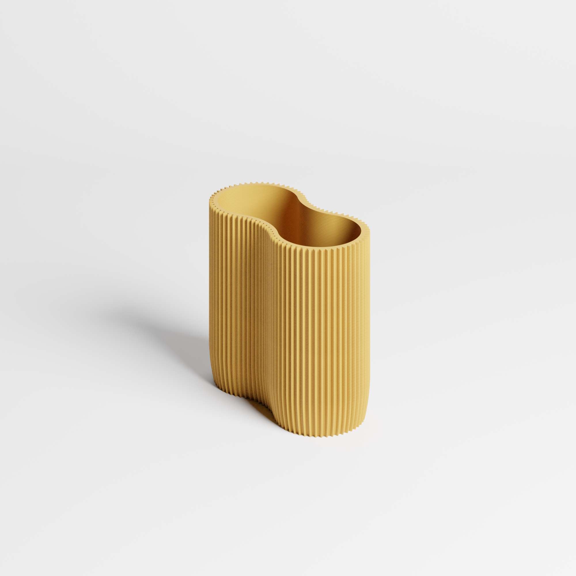 A modern, ribbed pen holder in a mustard yellow colour, set against a clean white background.