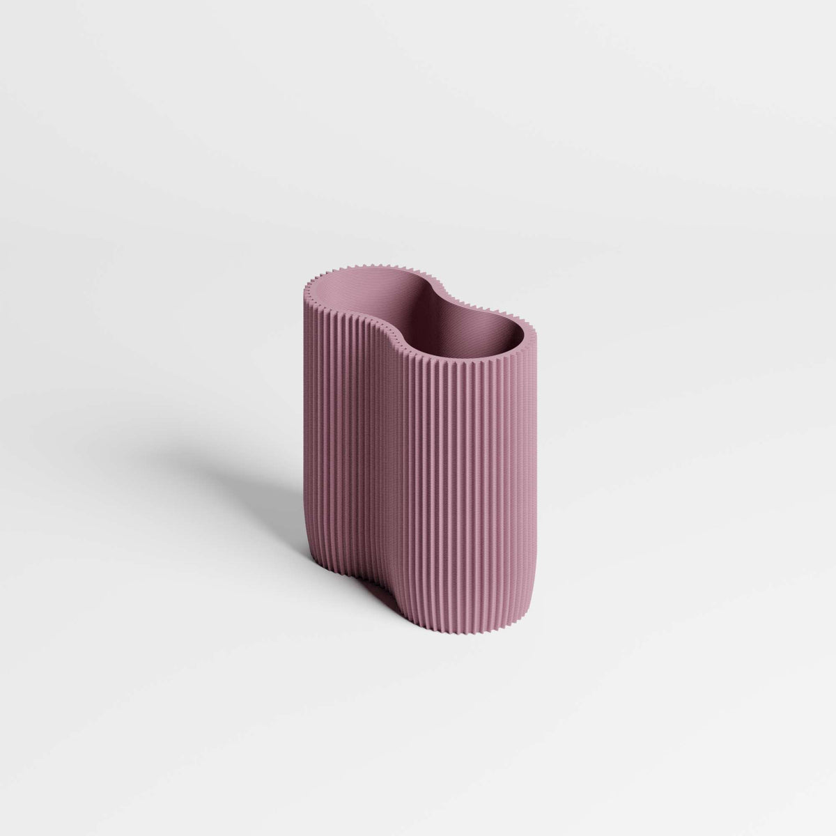 A modern, ribbed pen holder in a dusty mauve-purple colour, set against a clean white background with a soft shadow.