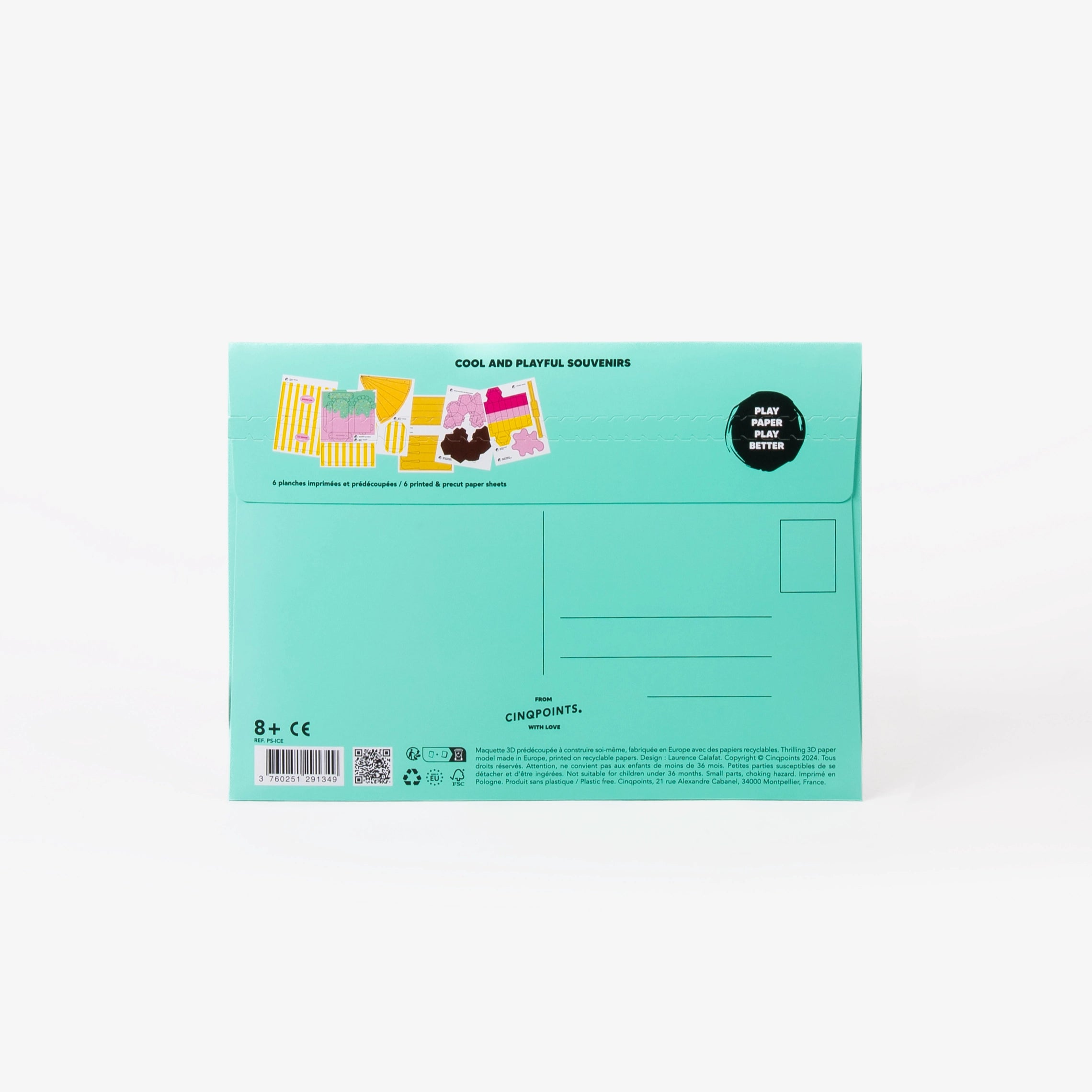 The back of a turquoise cardboard mailer envelope, featuring product details, address lines, stamp location, and a small graphic illustration, set against a clean white background.