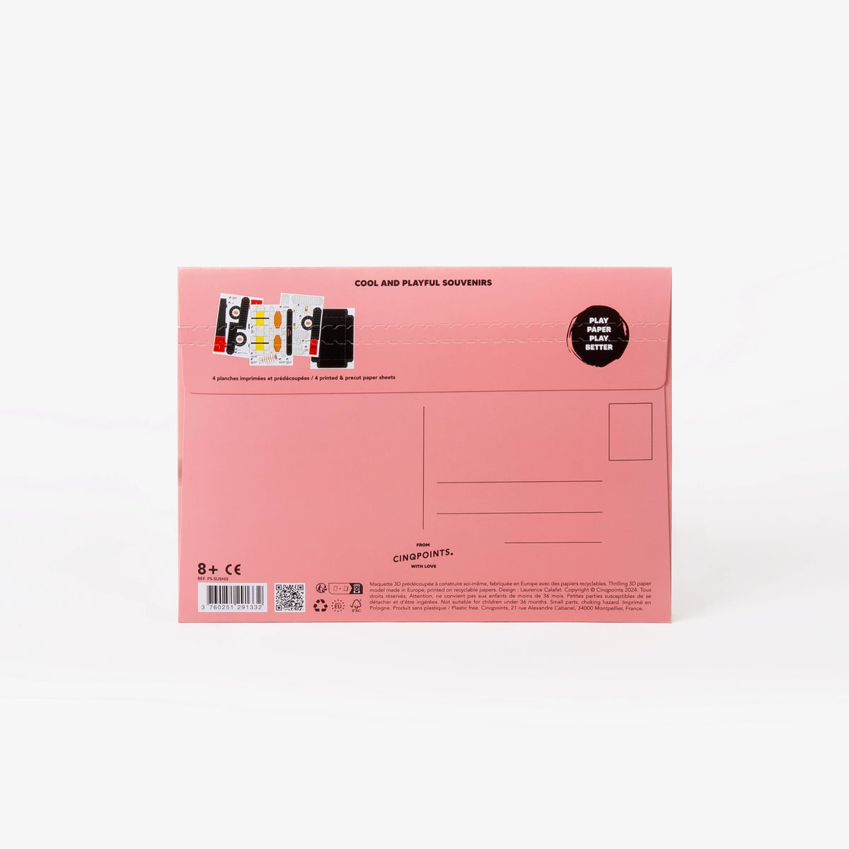 The back of a pink cardboard mailer envelope, featuring product details, address lines, stamp location, and a small graphic illustration, set against a clean white background.
